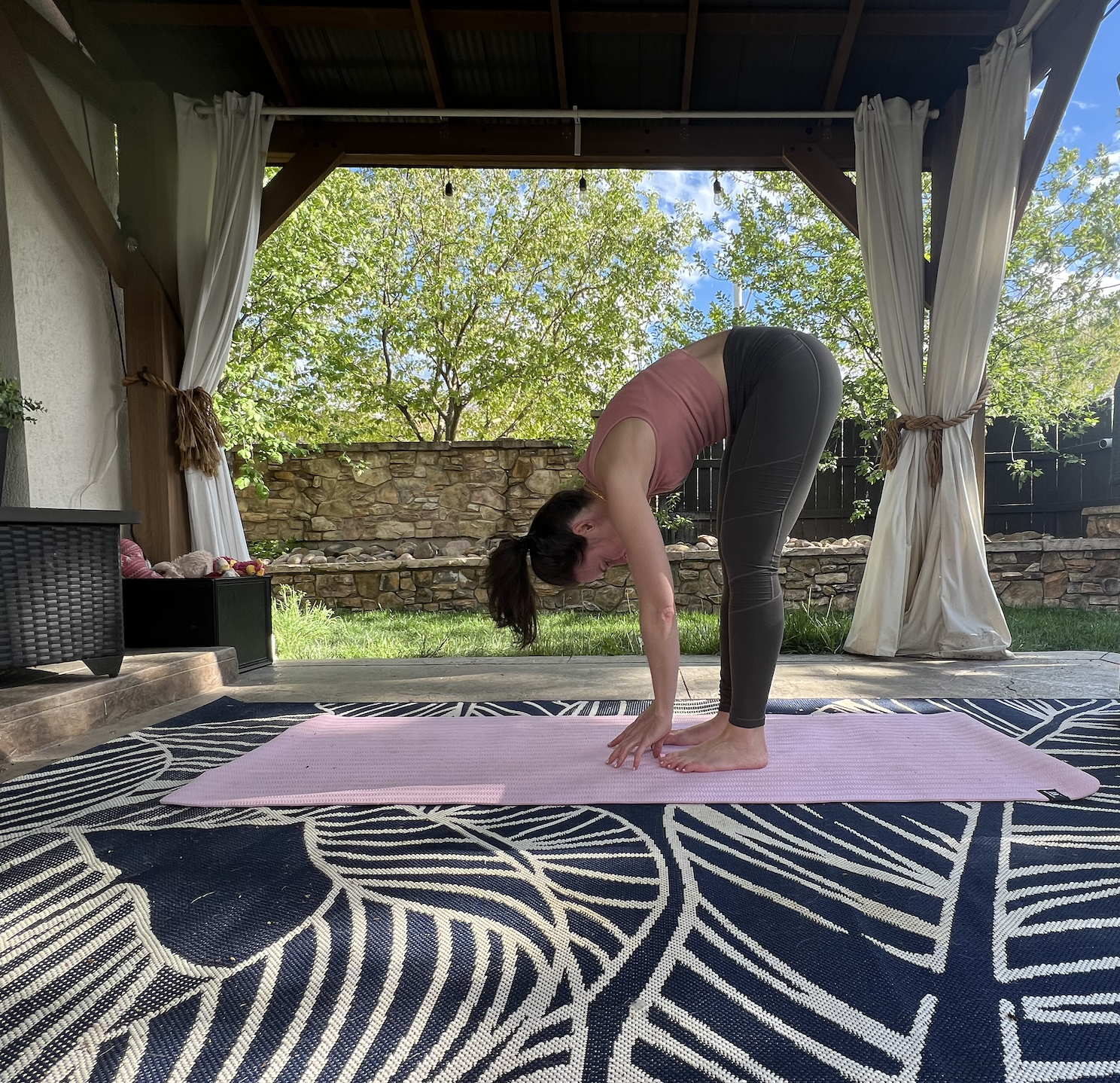 person doing forward fold pose